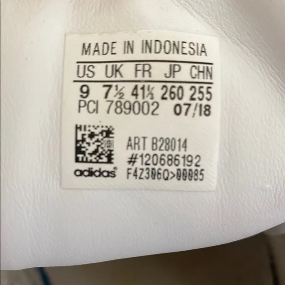 Adidas White and Black Athletic Shoes with Striking Design