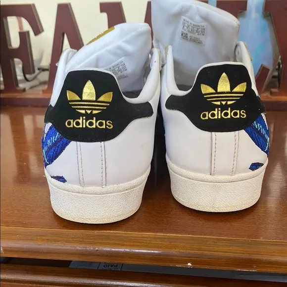 Adidas White and Black Athletic Shoes with Striking Design