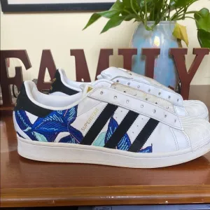 Adidas White and Black Athletic Shoes with Striking Design