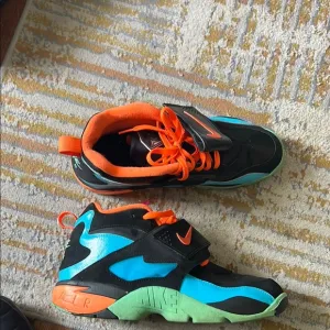 Nike Black and Blue Sneakers with Athletic Silhouette