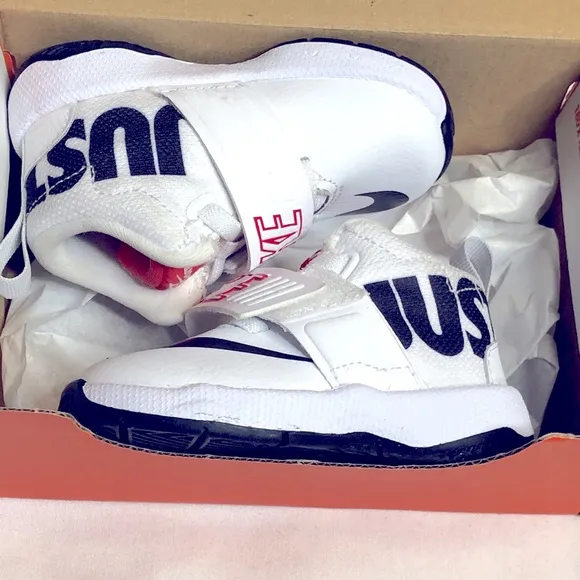 Nike Team Hustle D8 white black athletic shoes