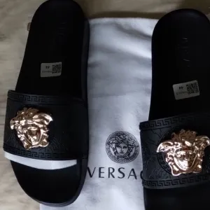 Versace Black and Gold Sandals with Signature Medusa Design